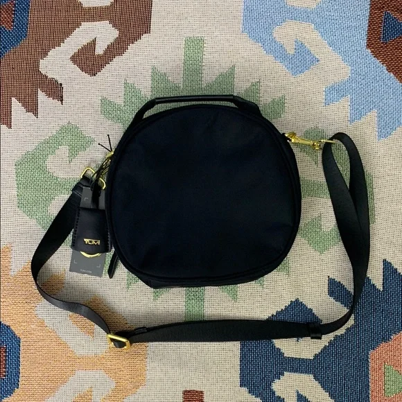 Tumi Black Crossbody Bag with Gold Accents - Picture 3 of 8